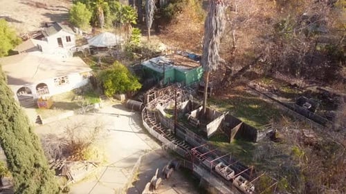 Aerial View of Damaged Buildings and Derelict Ride