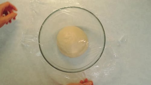 Wrapping the Dough with Cling Film