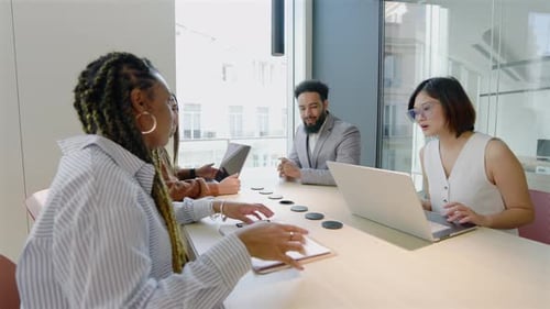 A Diverse Business Team Collaborating Effectively in a Modern Office Environment Together