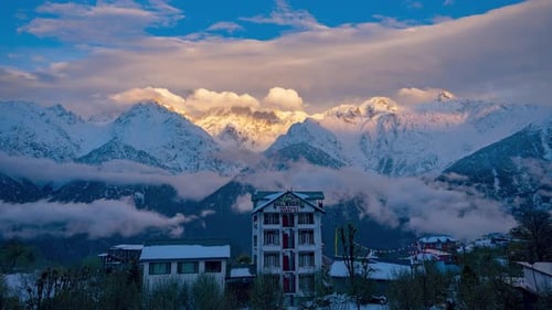 4k Timelapse Golden Sunrise on Himalayan Peaks Above a Snowy Mountain Village Hotel (4K UHD)