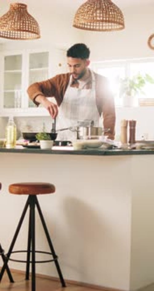 Man, chef and cooking with pan in kitchen for food preparation, hospitality or meal at home