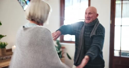 Senior Couple Dancing Happily Together Indoors