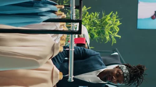 People Shopping for Clothes in a Boutique