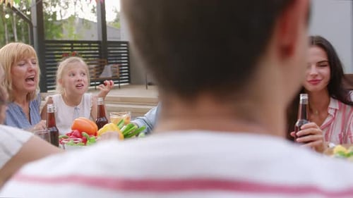 Big Family Garden Party Celebration, Gathered Together at the Table Relatives and Friends, Young an