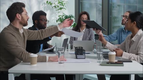 Team Having Discussion Around Conference Table