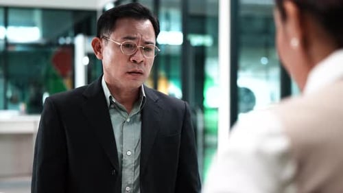 Man Discussing Business in a Modern Office