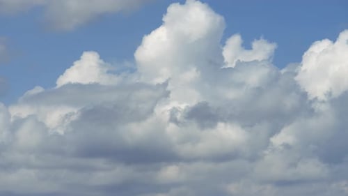 White Clouds Float Peacefully Across the Blue Sky