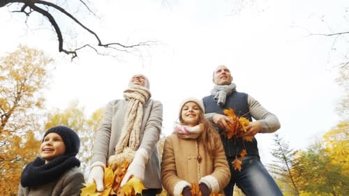 Happy Family Playing in Autumn Park
