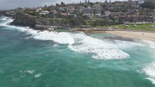 Bronte Beach - Aerial View Of Ocean Waves Crashing At Bronte Baths And Rocky Swimming Basin In Sydne