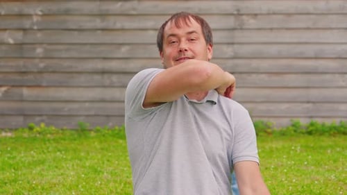 Loving Daughter Hugs Father in the Yard