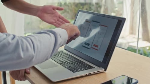 Pricing Review on Laptop in Bright Workplace