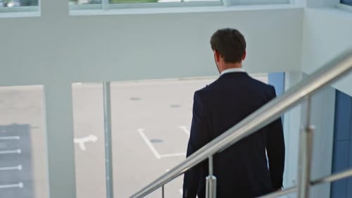 Businessman Descending Office Stairs Holding Briefcase Man Walking Downstairs