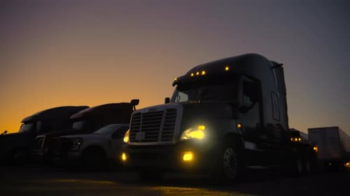 Trucks Parked at Truck Stop at Sunrise