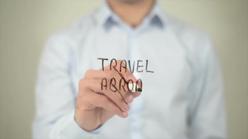 Travel Abroad Man Writing on Transparent Screen