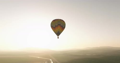 Hot Air Balloon Soaring at Sunrise