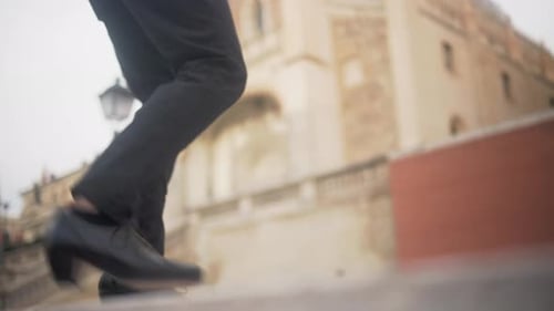 Feet Tap Dancing on Steps in Cityscape Backdrop