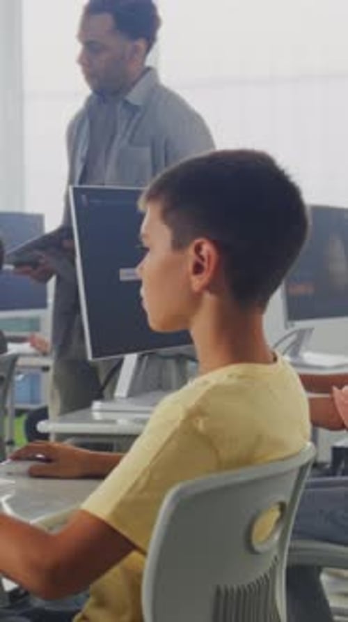 Primary School Students Working on Computers Studying Artificial Intelligence Technology