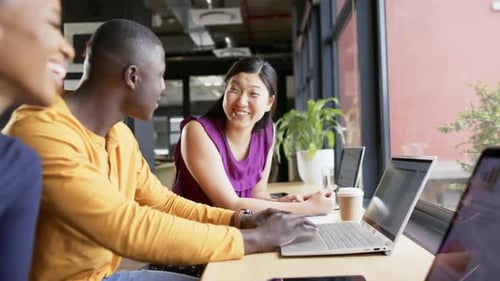 Casual diverse business people talking working together in office, slow motion, copy space