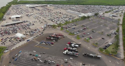 Aerial View of Auction Dealer Company Big Parking Lot with Parked Cars Ready for Remarketing
