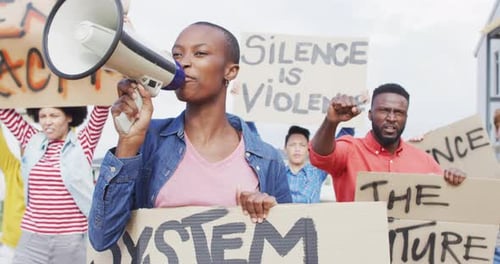 Protestors Shouting and Holding Signs at Demonstration
