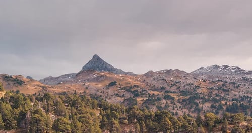 Close up Timelapse of Pic d Anie mountain in Spain France border under cloudy dramatic sky in a fall