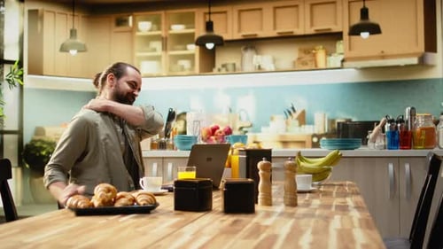 Man Working from Home in Bright Modern Kitchen