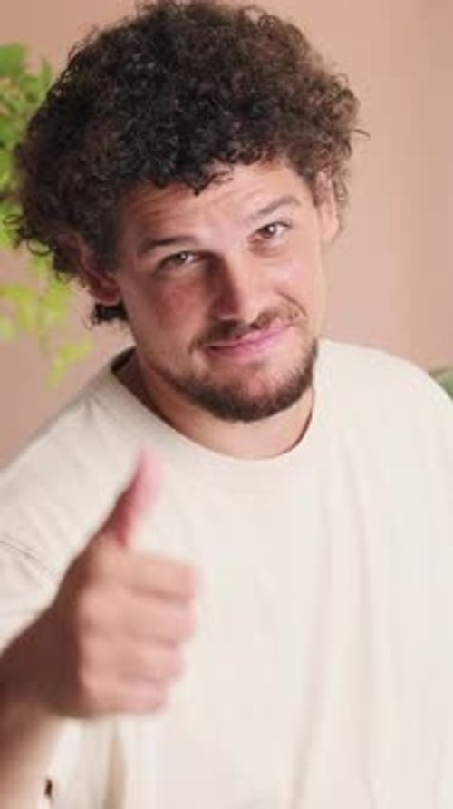 Man Smiling and Giving Thumbs Up Close Up