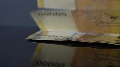 Video of counting Korean banknotes by hand, symbolizing financial operations