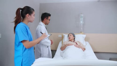Specialist doctor man and nurse explaining and check with elderly patient in hospital.