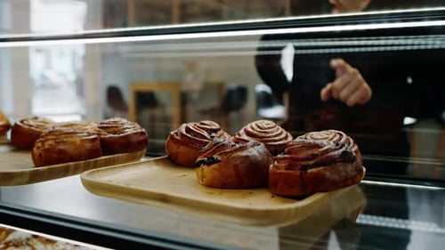 Counter full of delicious buns and pastries in a shop, bakery