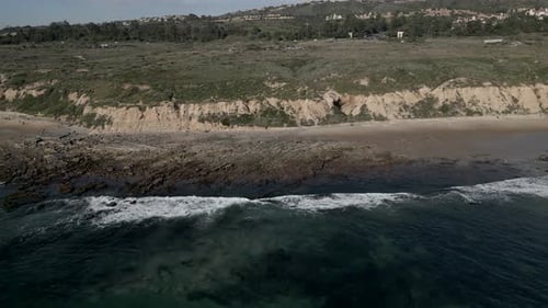 Drone Flying Away From Beach Coastline Crystal Cove State Park