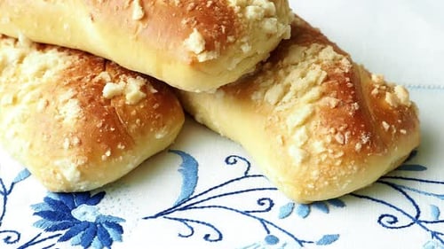 Close Up of Tasty Buns on Embroidered Cloth