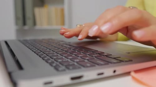 Close up side view hands of professional business woman typing on laptop notebook keyboard.