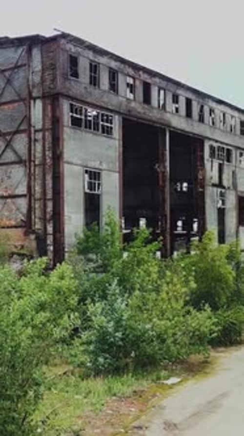 Destroyed factory after the bombing of the city of Donetsk Ukraine. Vertical video