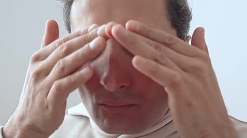 Cosmetic and Skin Care Procedures at Home A Middle Aged Man Applies Cream to His Face Metrosexual