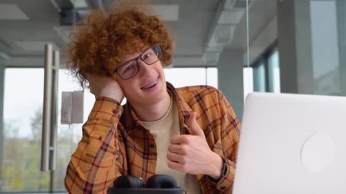 Portrait of Male Freelancer During Break From Web Working Online Hipster Blogger Sitting in Cafe
