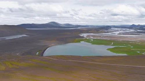 Aerial View of Braided Rivers and Hikers in Icelandic Valley
