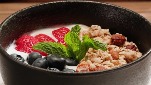 Yogurt Milk with Granola and Fruits Cereals a Nd Berries Healthy Breakfast in Cafe Chef Serving Food