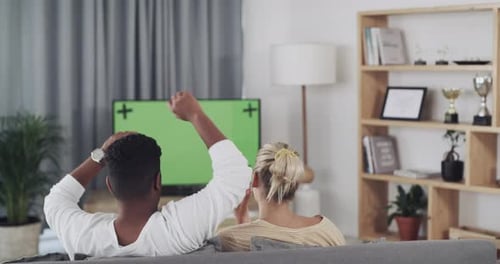 Friends, relax and watching tv on green screen, sofa or living room in rejection for entertainment