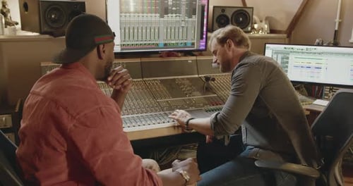 Male Musicians Composing in Recording Music Studio