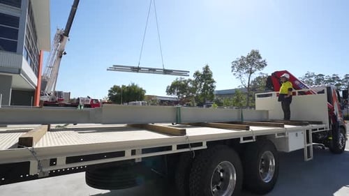 Crane Lifting Heavey Beam Weight From Truck Load