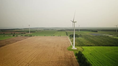 Drone footage of a wind turbine generating energy from wind