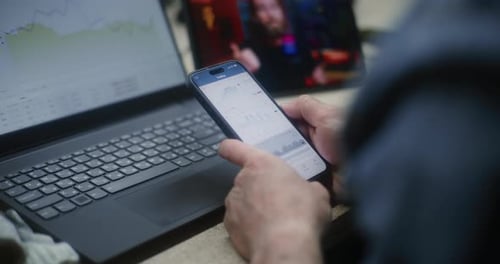 Adult Analyzing Data on Phone, Laptop and Tablet