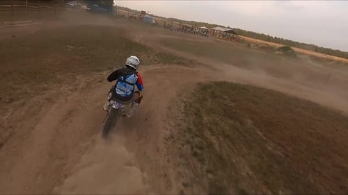 Rider Drives Motorcycle Around Circle Leaving Dust Trail