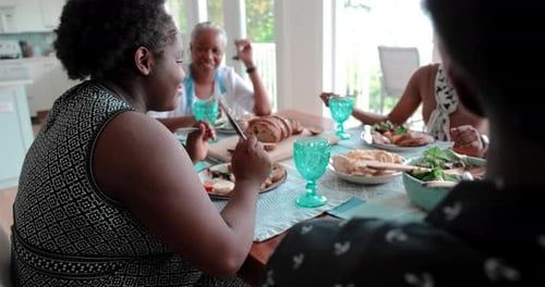 Family Gathering Enjoying Meal Together at Home