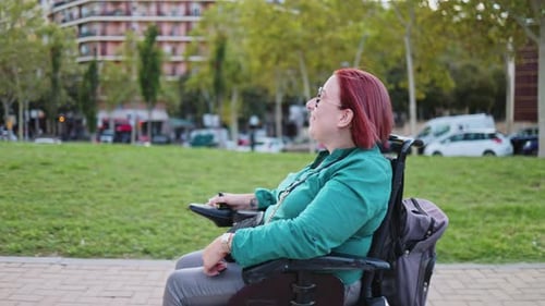 Happy disabled woman enjoying a relaxing day in the park