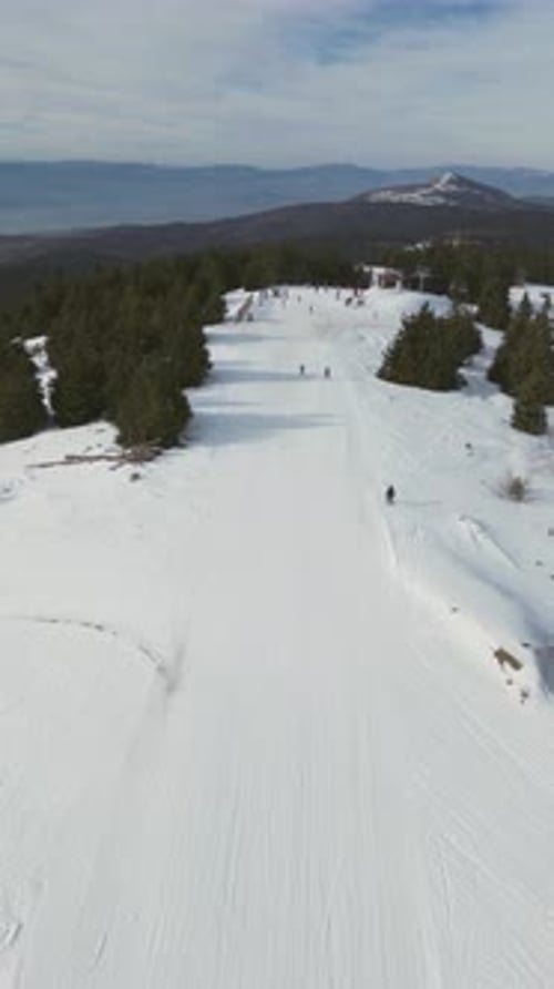 Alpine Ski Lift Aerial Drone View in Kopaonik Serbia Chairlift at Ski Resort Mountain Winter Forest
