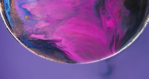 Abstract Liquid with Gold Glitter Close Up