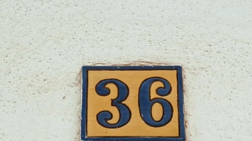 Number 36 (thirty-six) Affixed to a Building