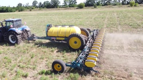 Blue Tractor O.A. Planting Canola On No Till Field